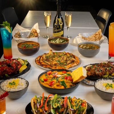 Various food items served on the table wuth drinks.