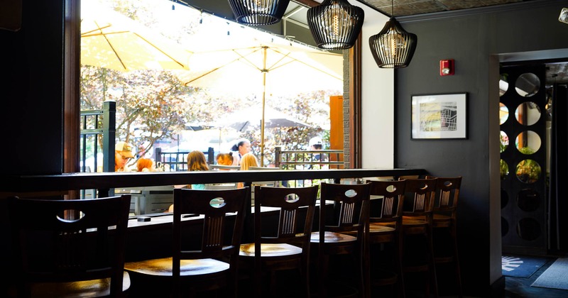 Interior, high chairs and tables by the windows