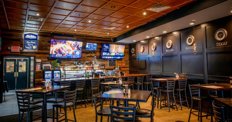 Seating tables with bar stools and bar