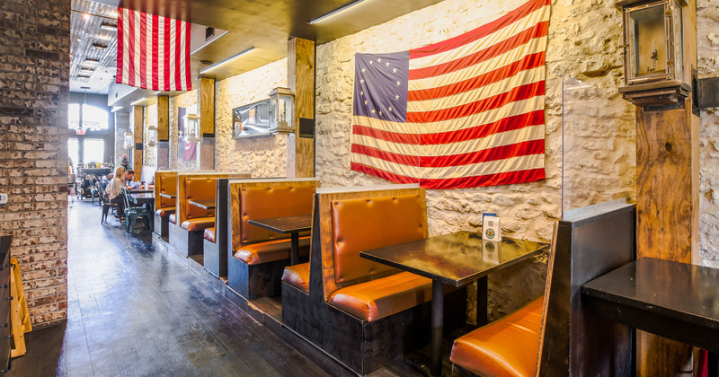 Interior, booth area with flag of United States on wall