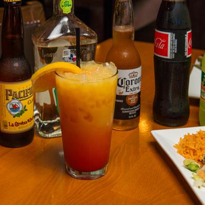 Tequila Sunrise cocktail and various bottled drinks.