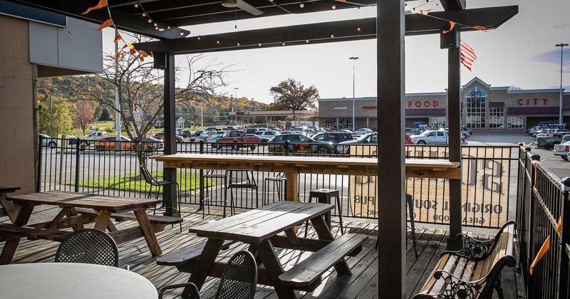 Outdoor seating area, wooden tables with benches