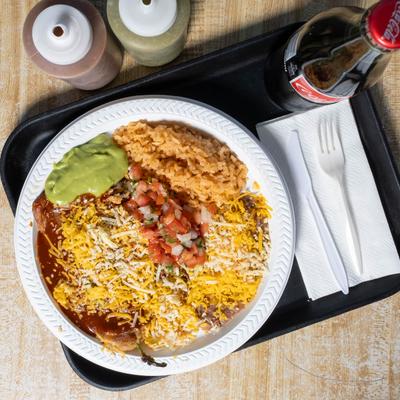 Stuffed chili pepper smothered in sauce, served with salsa, rice, and beans.