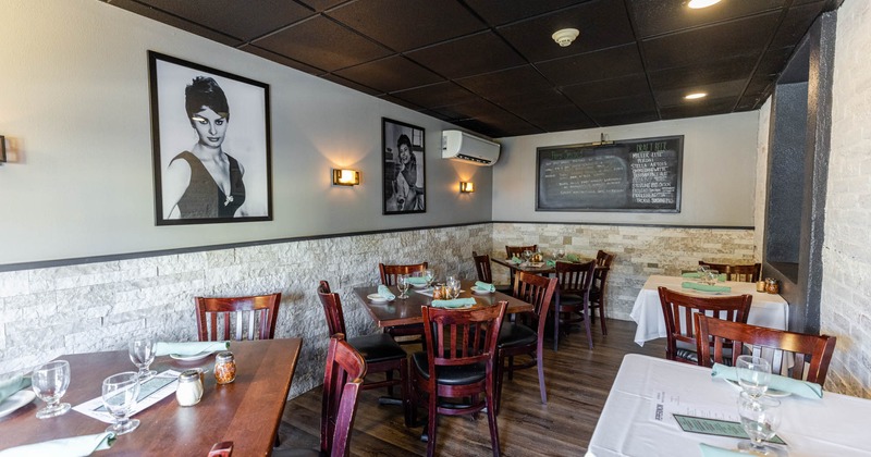 Interior, tables setup, pictures of old movie stars on a wall