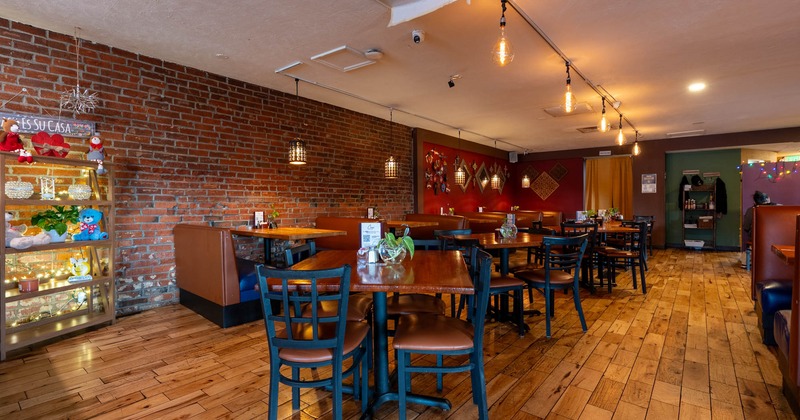 Interior, seating area with tables, chairs and booths