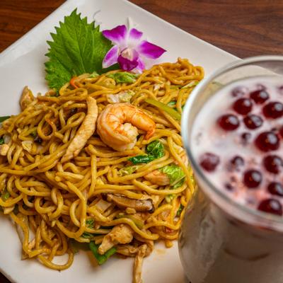 Fuji Yaki Lo Mein with chicken and shrimp and Boba tea in the foreground.