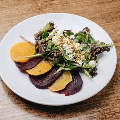 Beet salad with mixed greens and goat cheese.