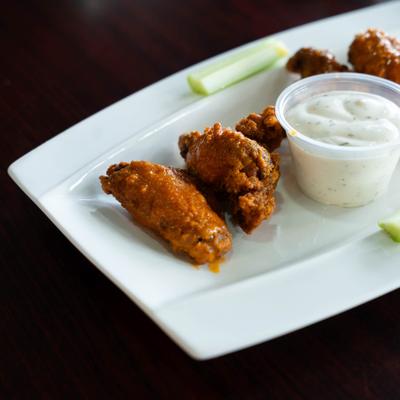 Buffalo chicken wings, with ranch dressing.