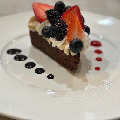 Flourless chocolate cake with fresh seasonal berries.