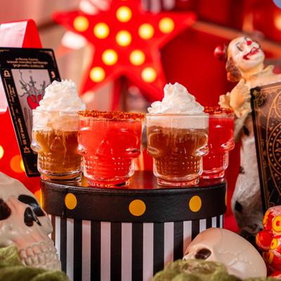 Ring Master cocktail flight served on a spooky circus table setup.