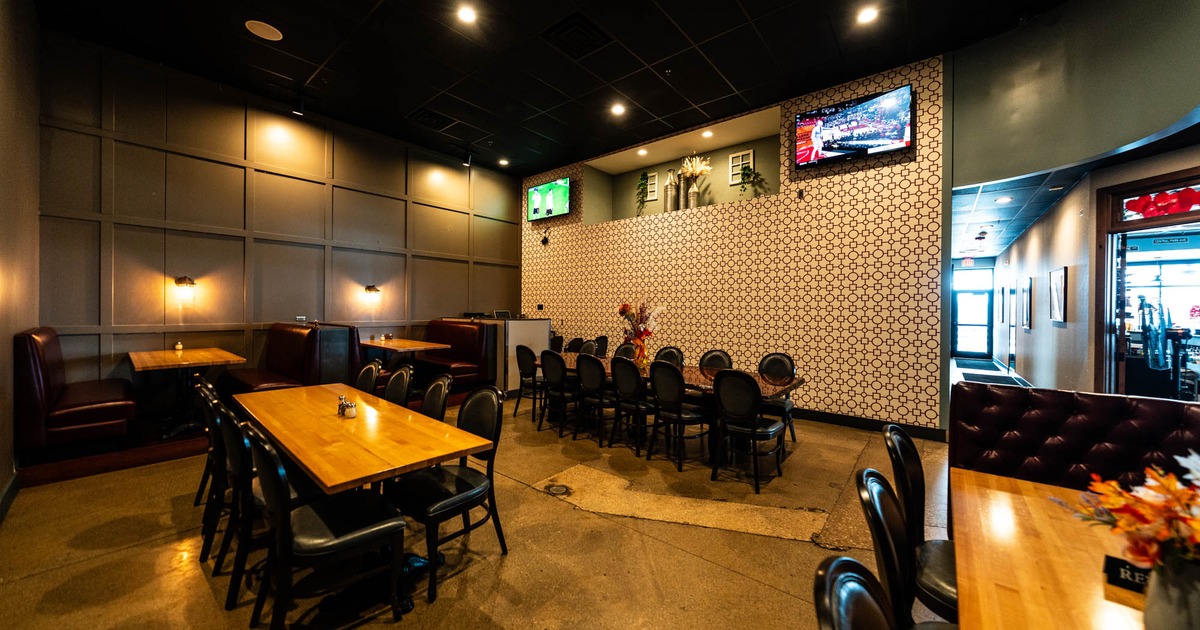 Interior, separate dining area, seating booths with tables, tables for ten and twelve