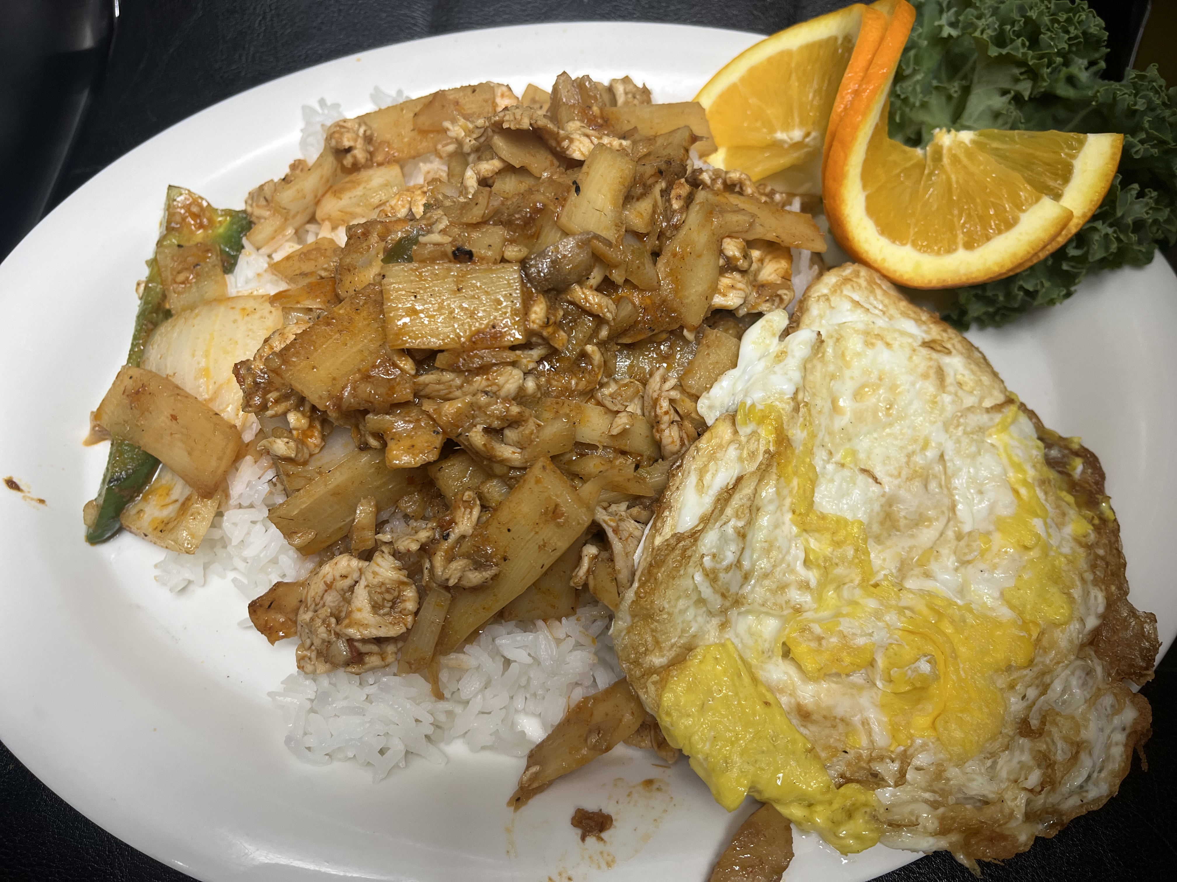 Chicken with bamboo shoots over rice with fried eggs Special