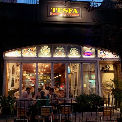 Outdoor seating area, customers sitting at the table.