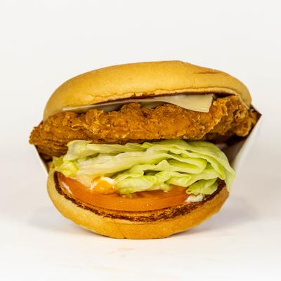 Crispy chicken burger with lettuce.