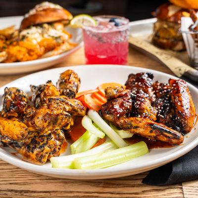 Chicken wings, celery, and carrots.