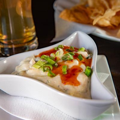 Crab Rangoon Dip, with crab meat, cream cheese, and Thai chili.