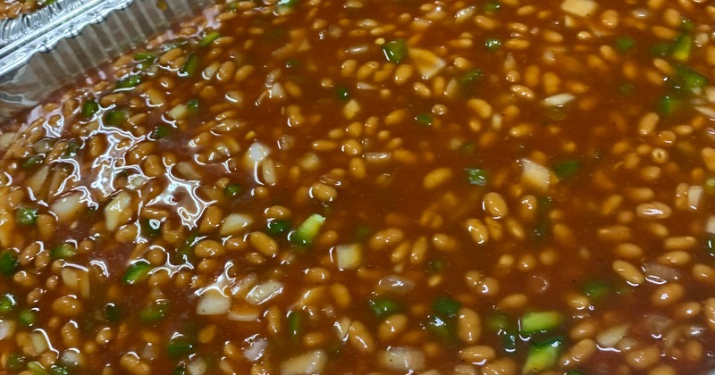 Baked beans served in a large aluminum tray