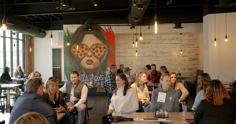 Interior, seating area with guests chatting