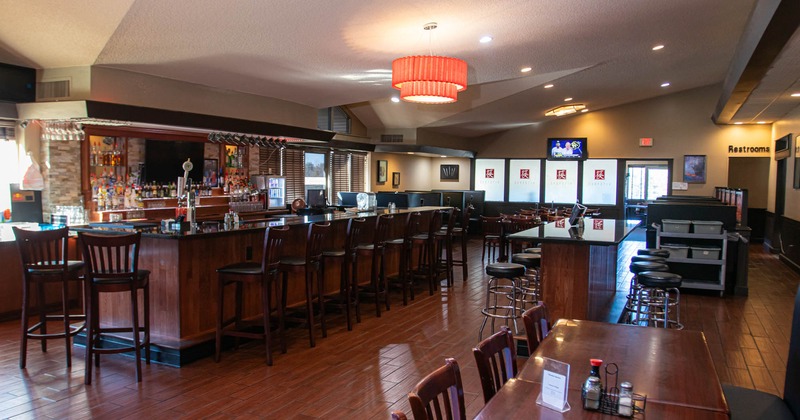 Interior, dining area, bar on the left