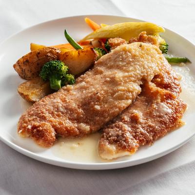 Chicken breast, breaded with parmesan and bread crumbs, served with roasted potatoes and vegetables.