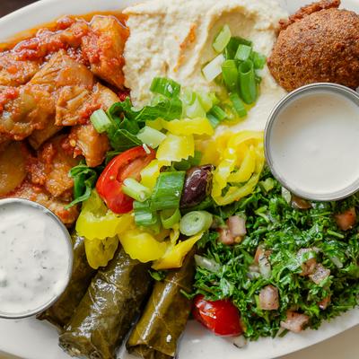 Veggie Combo Appetizer platter featuring falafel, hummus, dolmas and tabbouleh salad.