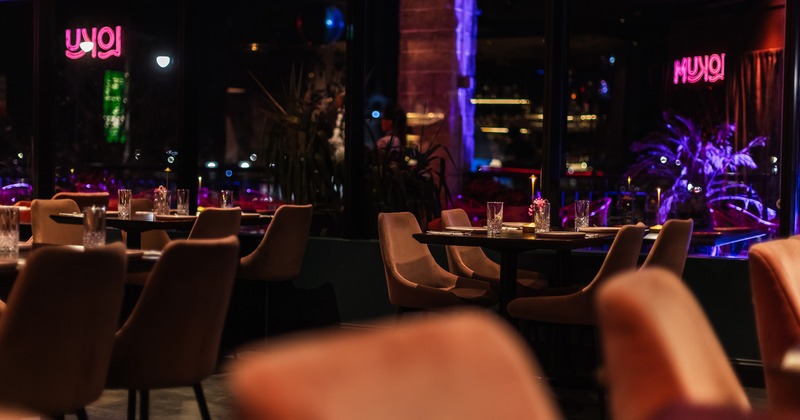 Modern and cozy interior dining area with set tables