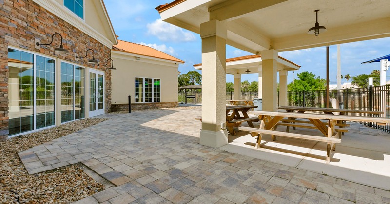 Exterior dining area, conjoined wooden tables and benches