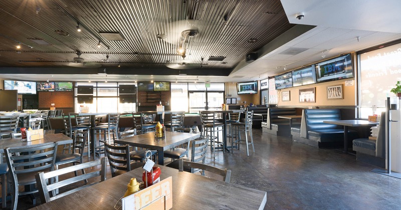 Indoor space with dining tables and booths