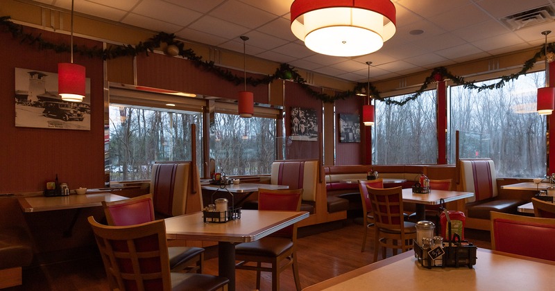 Interior, dining area with dining tables and booths