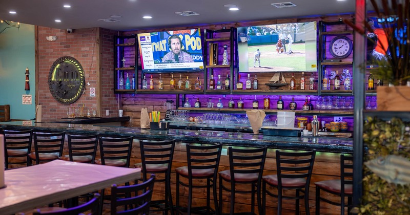 Bar area, neatly lined up bar stools