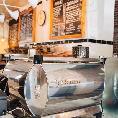 Kitchen accessories and boards on the wall.
