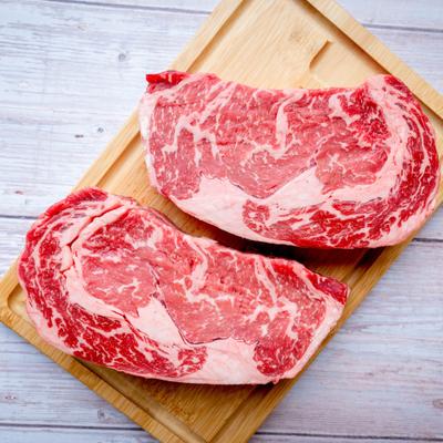 Raw prime New York strip steak.