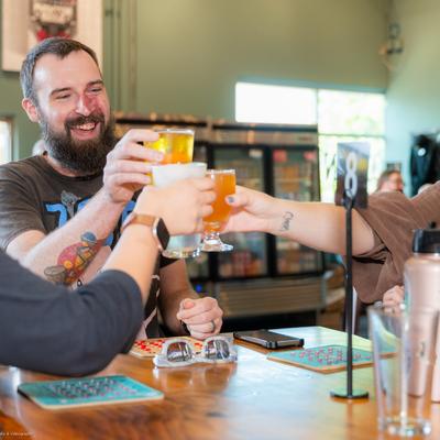 Guests toast with beer