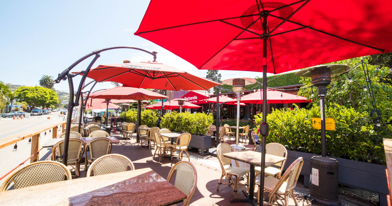 Outdoor seating area with a red sun umbrellas