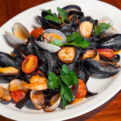 Seafood Squid ink homemade pasta with marinara sauce.