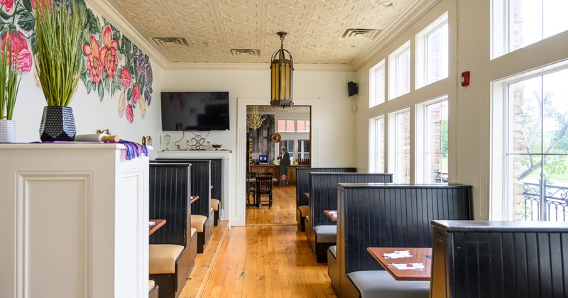 Interior view of a restaurant featuring dark wooden booths
