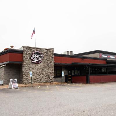 Player's Pub and Grill, Single-story restaurant with a stone facade and red accents