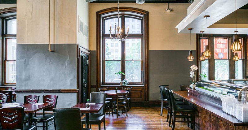 Interior, dining area near bar with large window