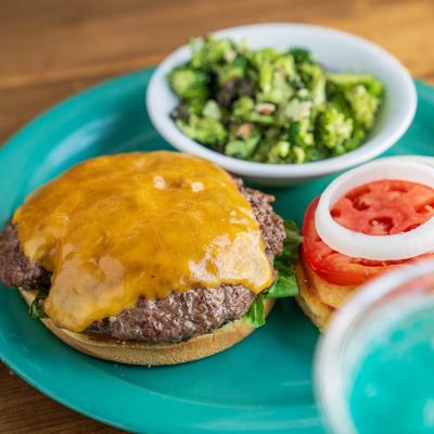 Handmade Burger with Broccoli Salad on the side.