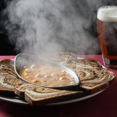Warm Banana Pepper Dip with toasts and a glass of beer.