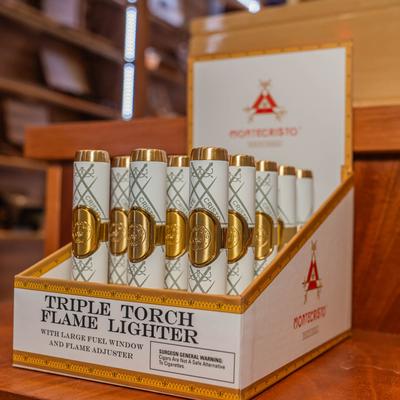 Montecristo Triple Flame Cigar Stick Lighters in the box.
