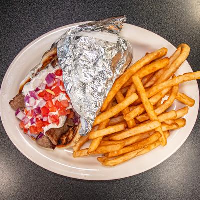 Gyro wrap with sauce, diced tomato and onion, served with fries.
