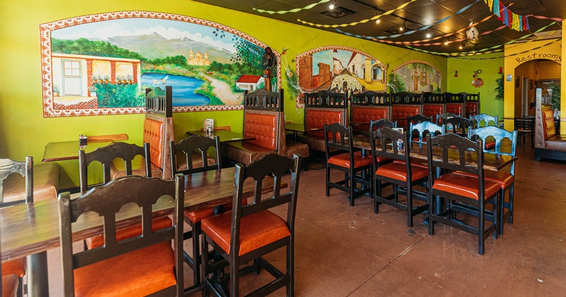 Interior, dining booths and tables, mural art, wide view