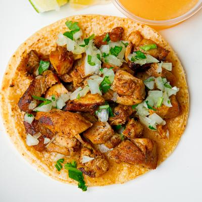 Chicken taco, with onions and cilantro.