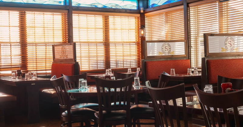 Interior, tables and chairs in dining area