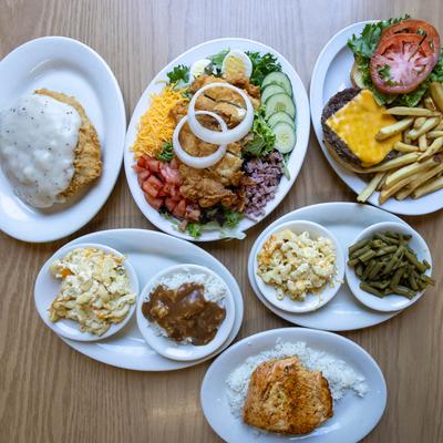 A variety of dishes on a wooden table.