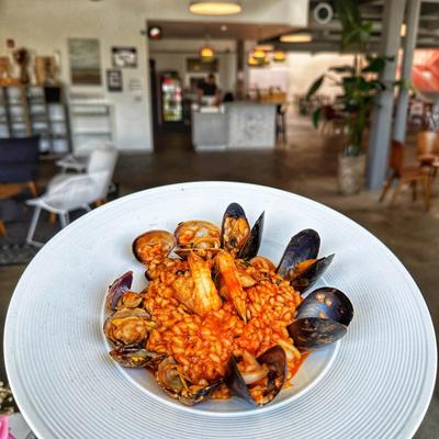 Shrimp, Baby Squid, Clams, Baby Octopus in Red Sauce with risotto alla Pescatora.