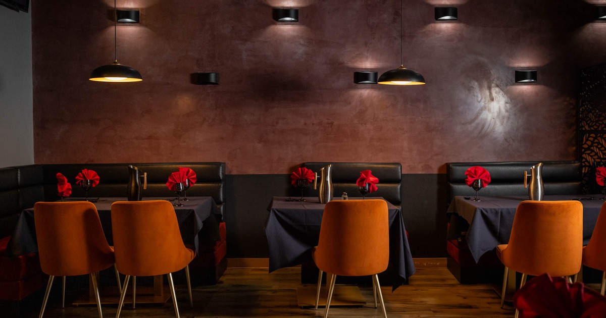Interior, banquette seating area, tables and chairs