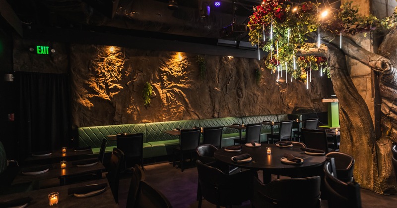 Interior, dining area, tables with chairs, round table for six, banquette bench with tables