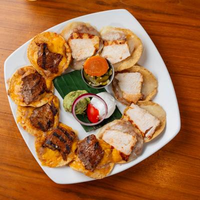 Fajita nachos with beef and chicken, top view.